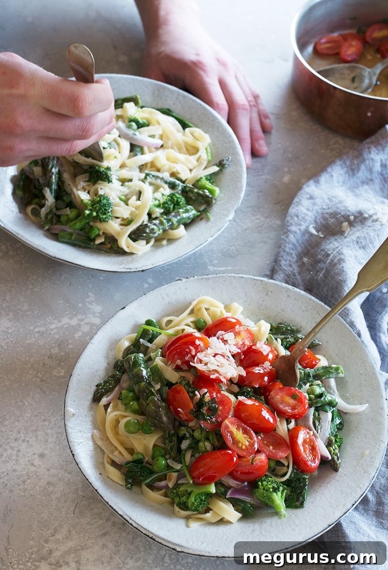 A person enjoying a bowl of Pasta Primavera, highlighting the appetizing nature of the dish.