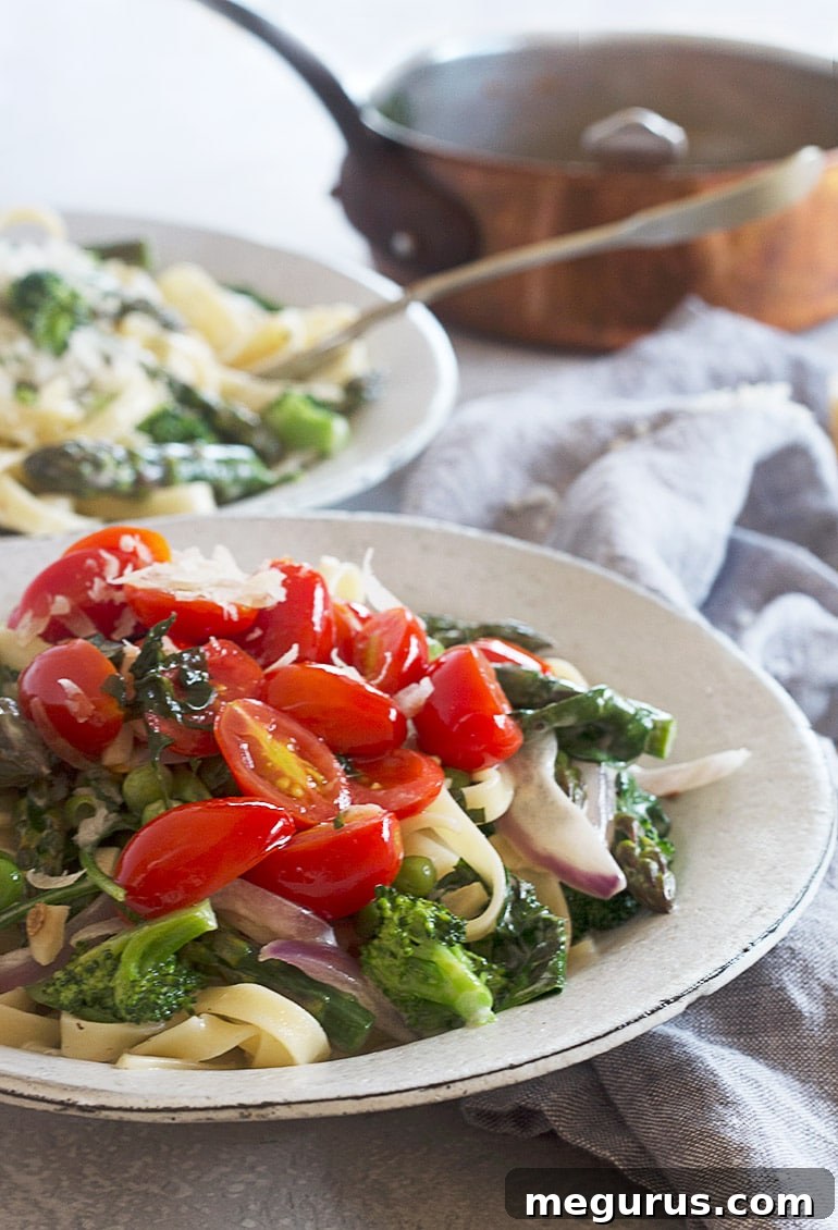 A beautifully plated bowl of finished Classic Pasta Primavera, ready to be served and enjoyed.
