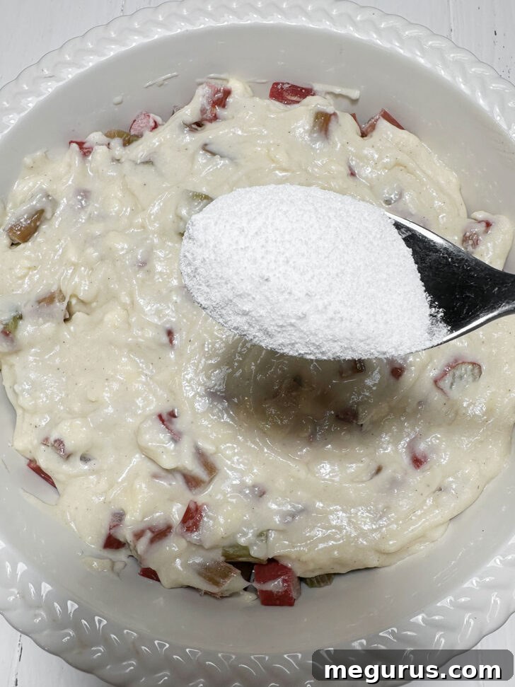 Sprinkling the batter with sugar mixture.