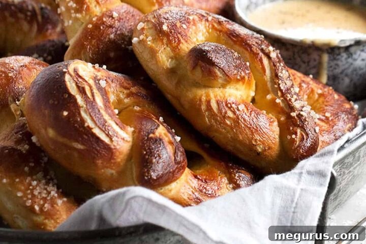 soft pretzels on tray with a cup of beer cheese