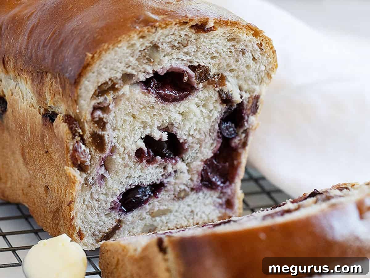 Fresh Cherry Yeast Bread sliced, showcasing fruit and nuts