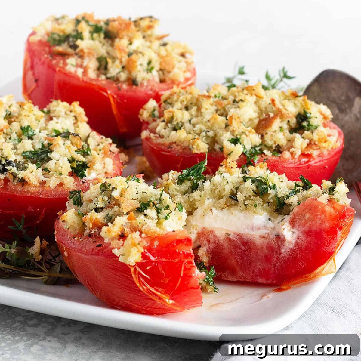 tomatoes stuffed with goat cheese on plate