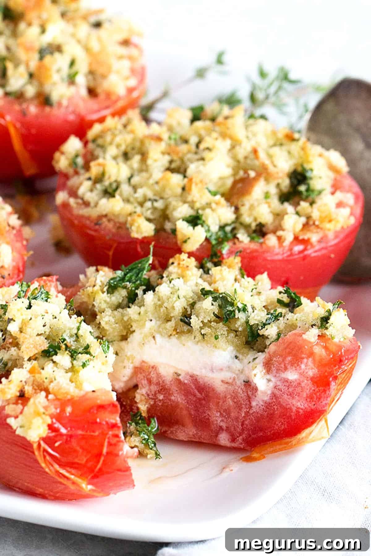 baked tomatoes with crumb topping on plate