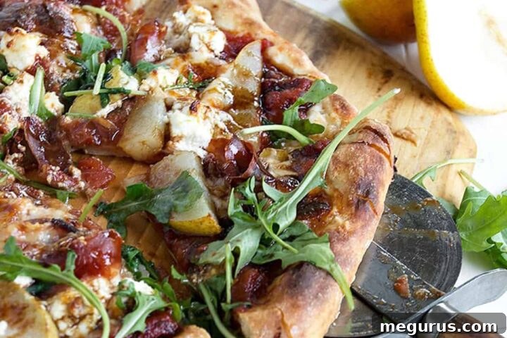 Pear Prosciutto Pizza on pizza peel, showcasing the delicious toppings.