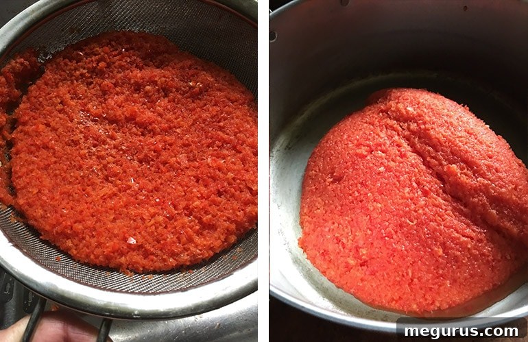 The thoroughly drained red pepper puree being carefully transferred from the sieve into a large, heavy-bottomed saucepan.