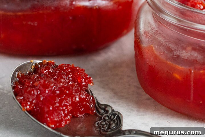A final shot of delicious homemade red pepper jam in elegant jars, ready to be enjoyed or given as a thoughtful gift.