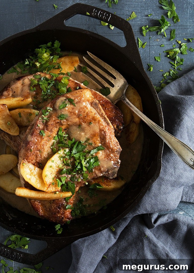 pork chops with sauteed apples in cast iron skillet