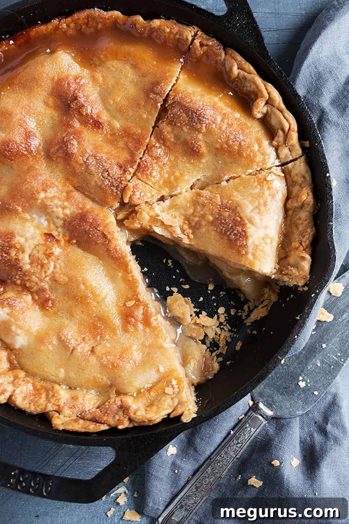 brown sugar peach pie sliced in cast iron skillet