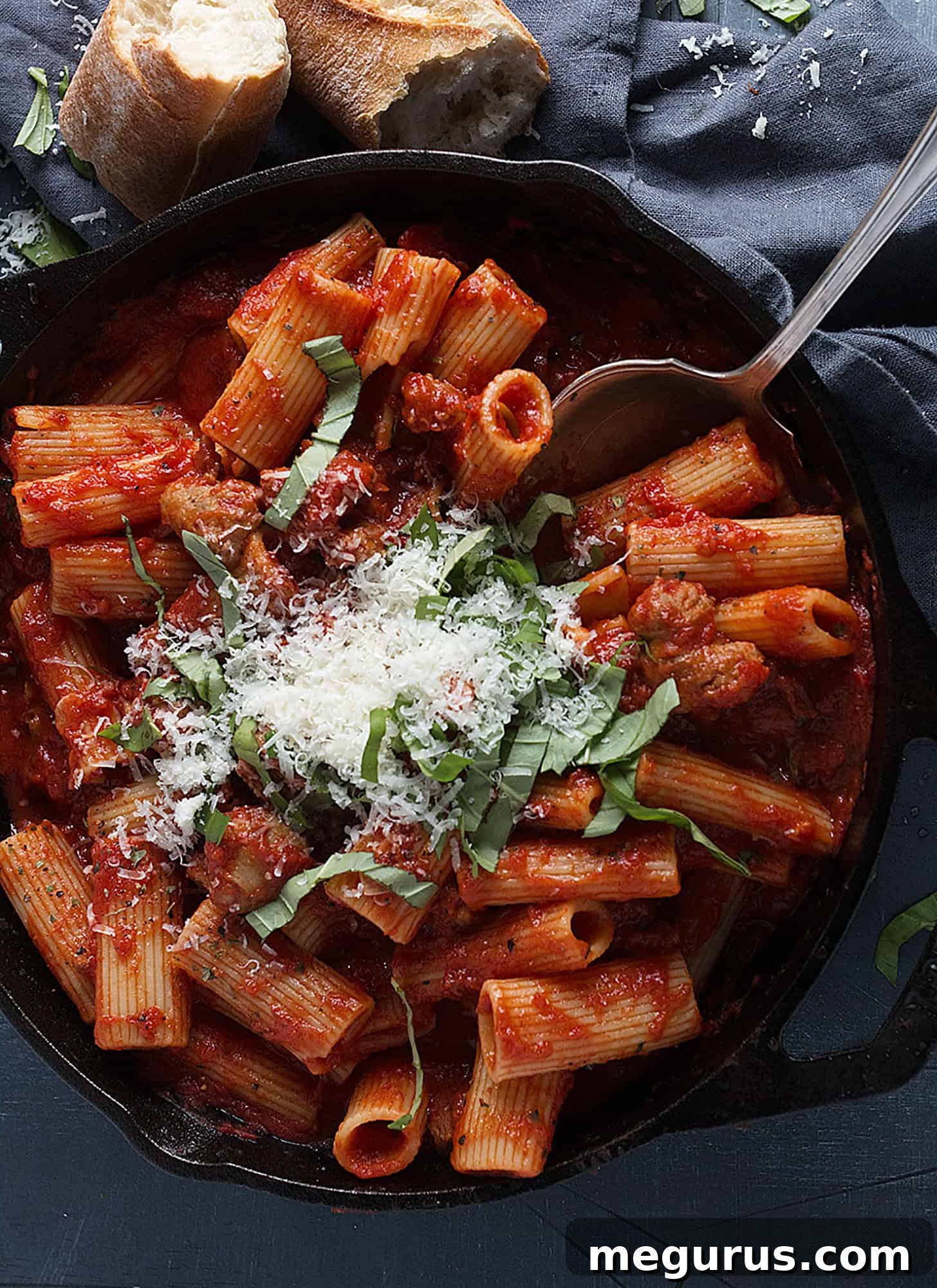 Close-up of freshly cooked Italian sausage pasta, garnished and ready to serve