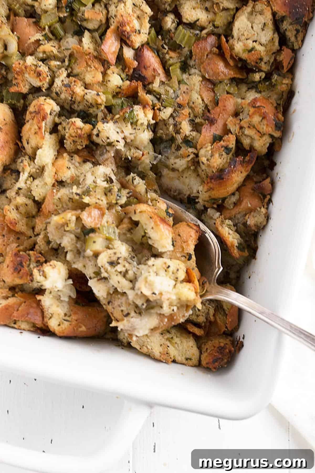 classic bread stuffing in casserole with spoon
