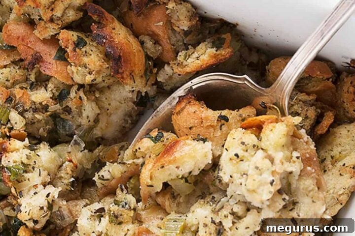 classic bread stuffing in casserole with spoon