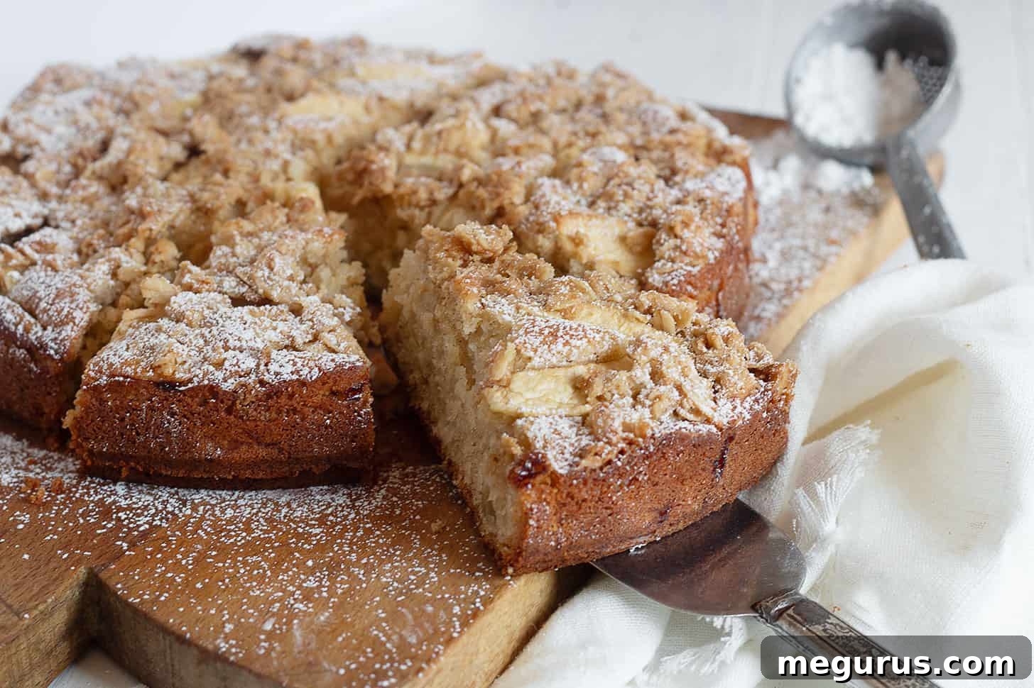 apple crisp cake sliced on cutting board