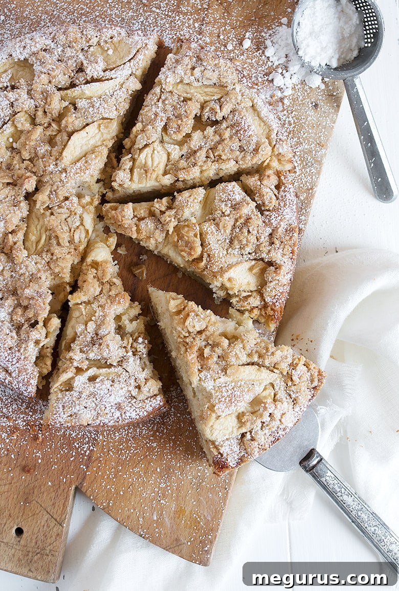 apple cake with crisp topping on cutting board