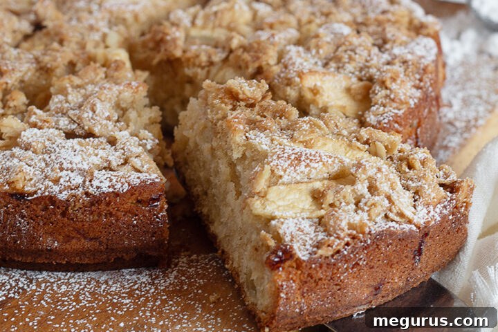 apple crisp cake sliced on cutting board