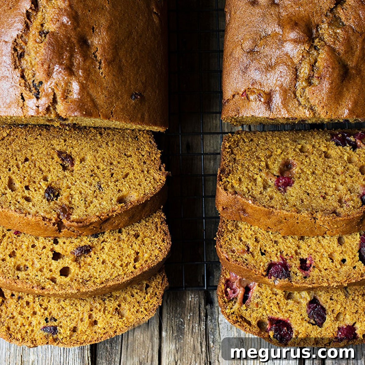 Slices of perfectly baked pumpkin bread on a cutting board