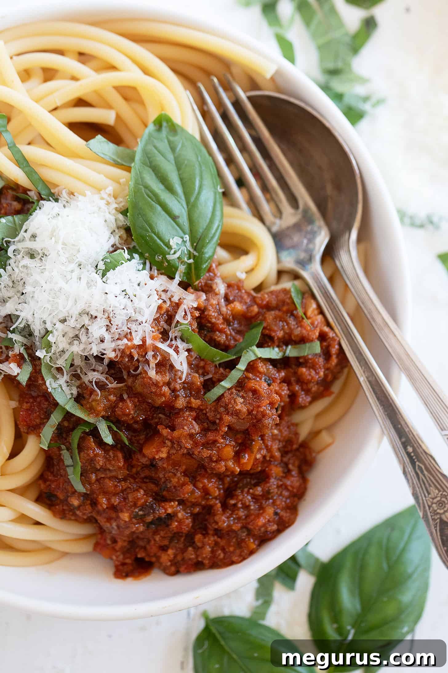 close-up of classic Italian meat sauce with spaghetti in bowl
