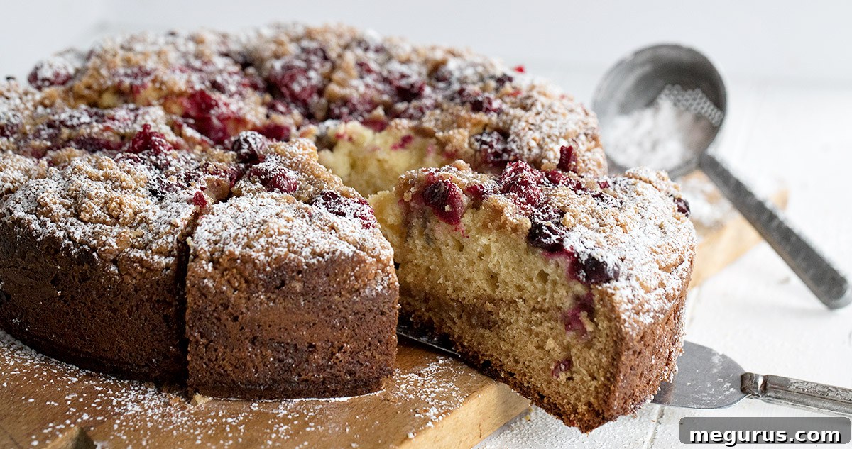 cranberry cake on cutting board