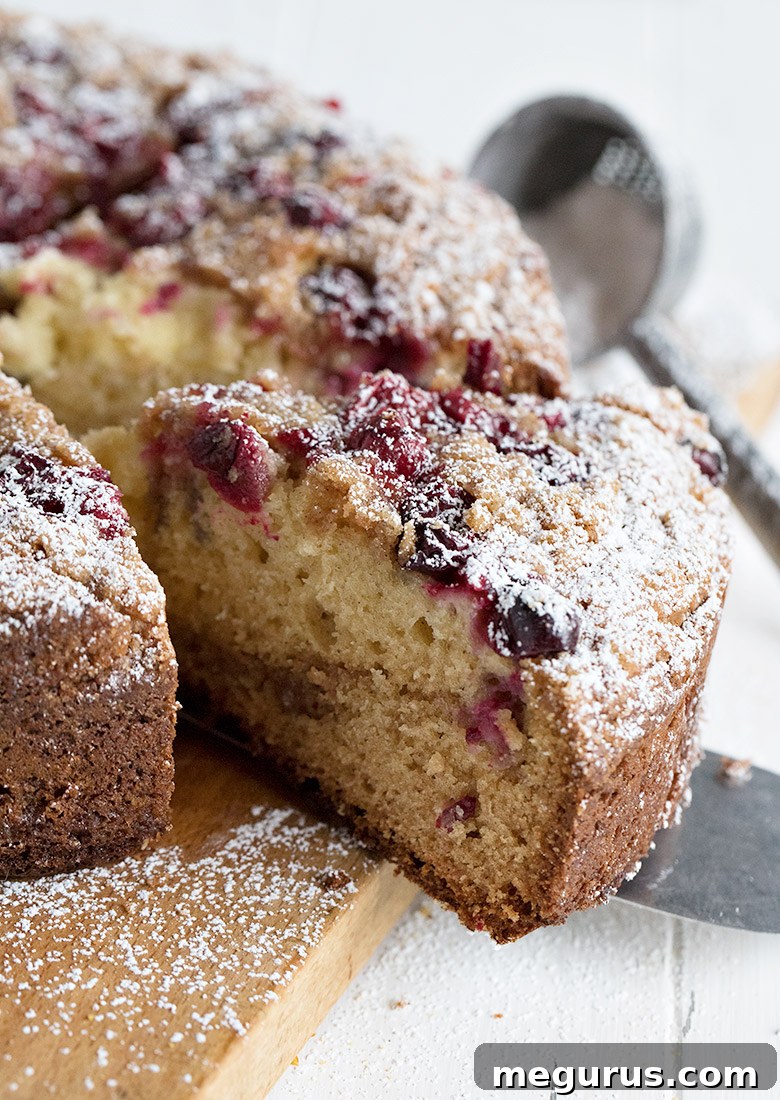 cranberry cake on cutting board