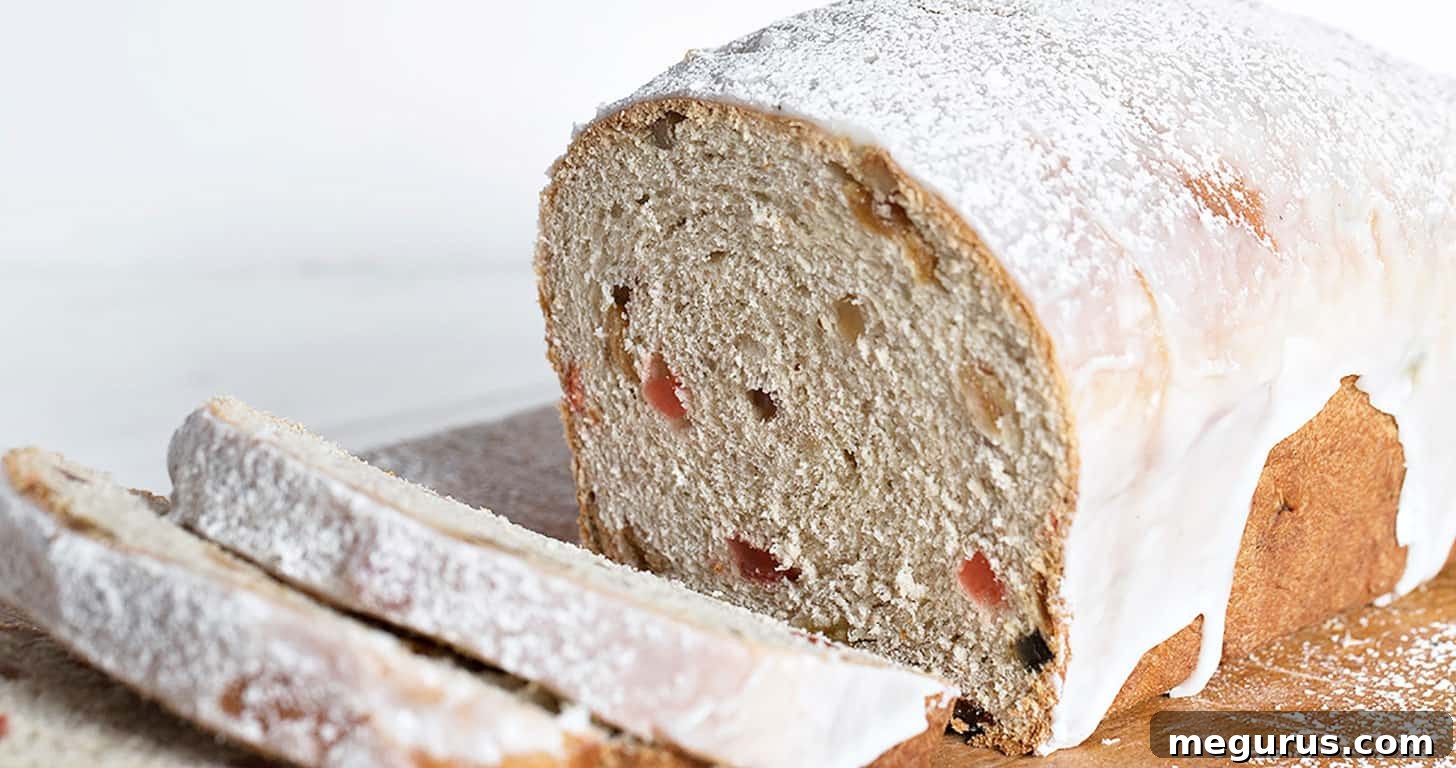 Sliced Chop Suey Bread on a wooden cutting board, revealing its fruit and nut-filled interior.