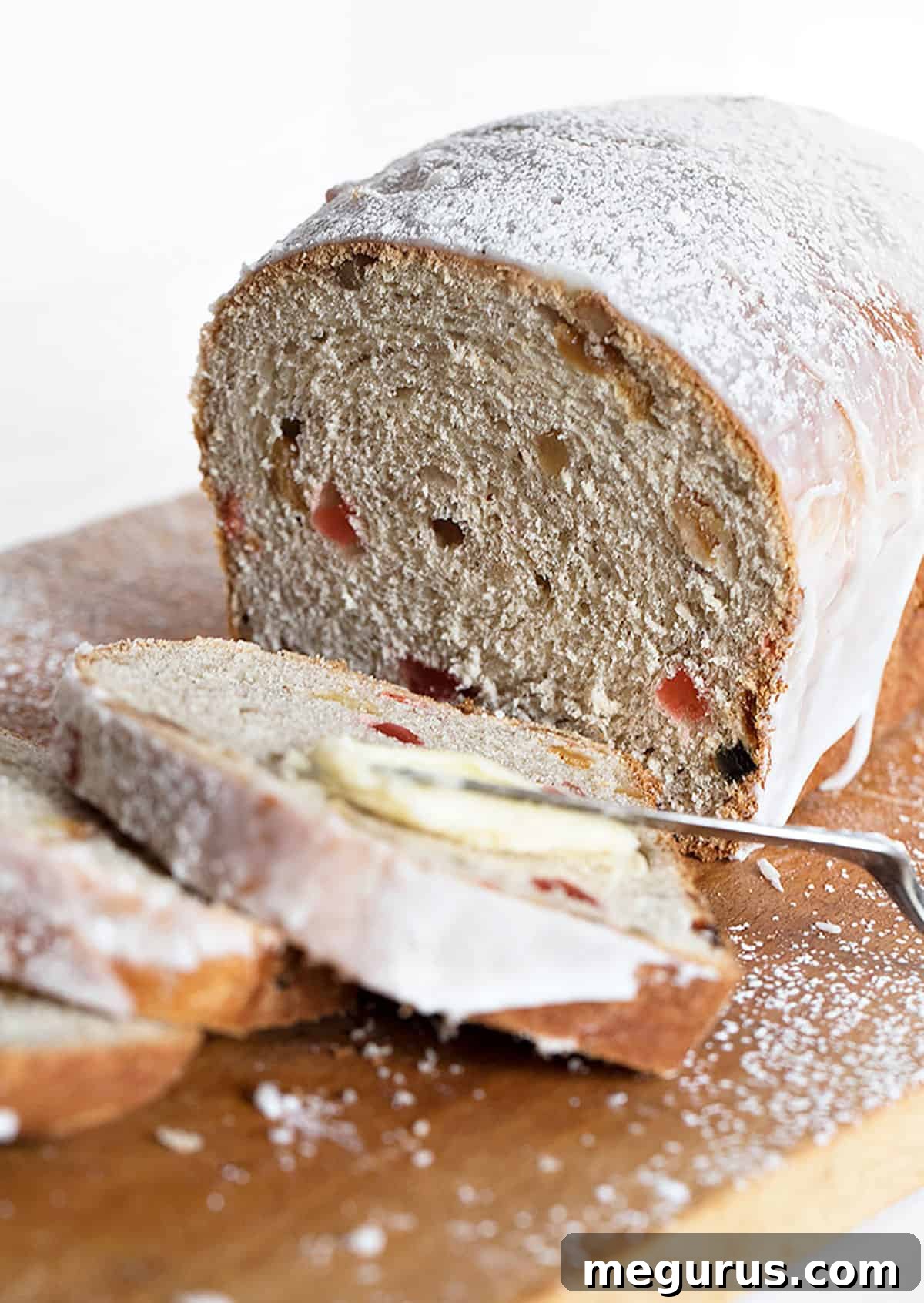 Close-up of a freshly baked Chop Suey Bread loaf, with sweet icing drizzled over it.