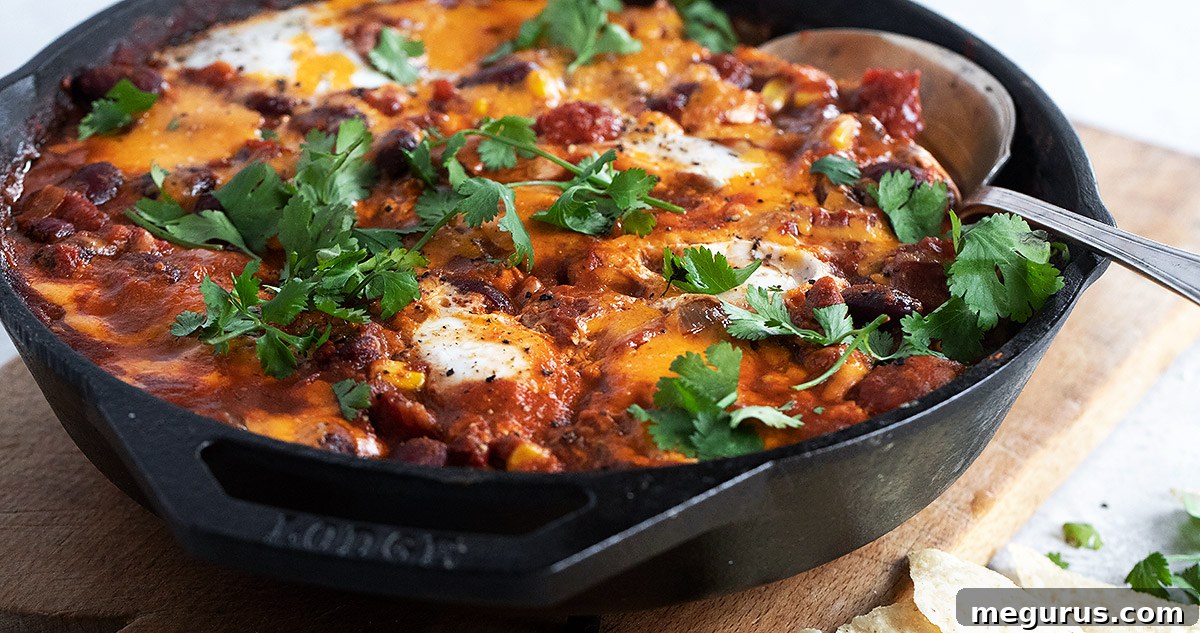 chili style shakshuka in a cast iron skillet
