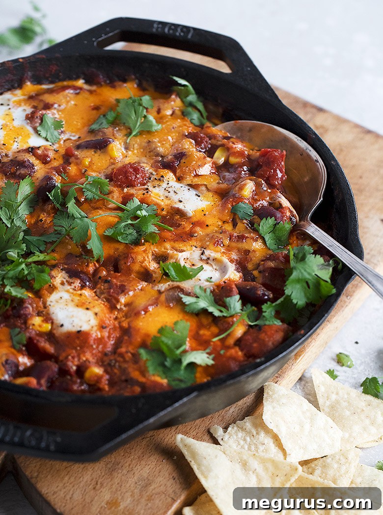 chili style shakshuka in a cast iron skillet