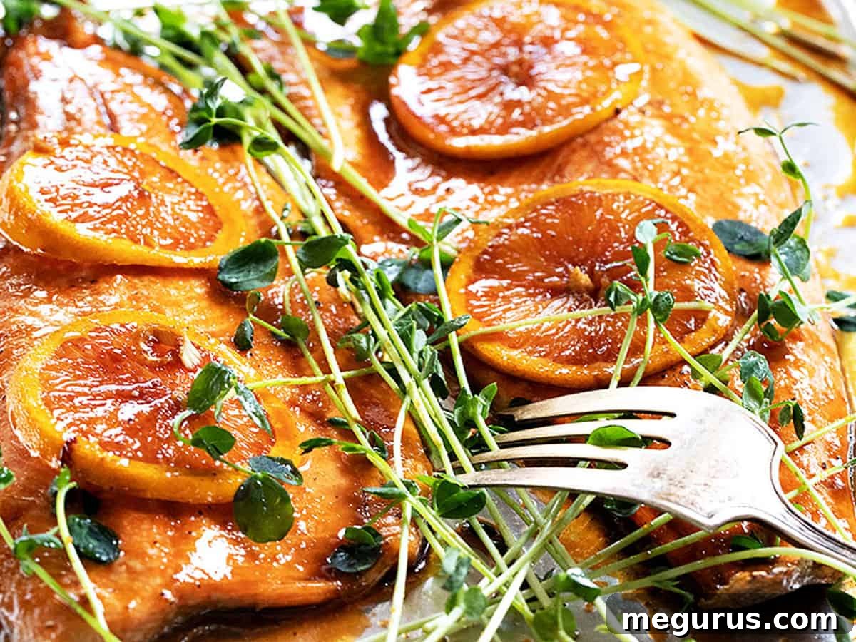 Delicious Asian orange salmon on a baking sheet, ready to serve