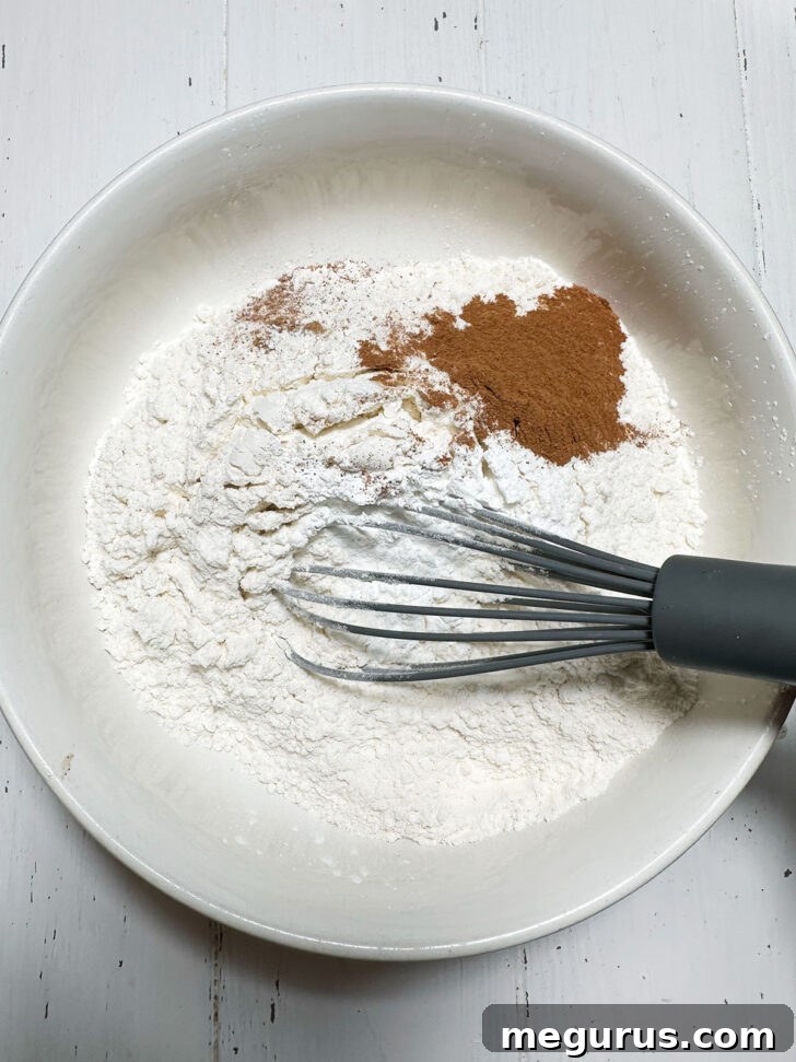 Whisking together the dry ingredients in a bowl for the rhubarb cake.