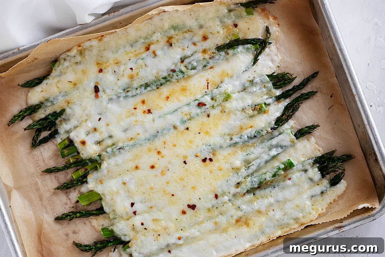 creamy asparagus on baking sheet
