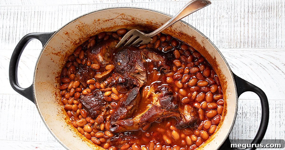 Pork and beans in a Dutch oven.
