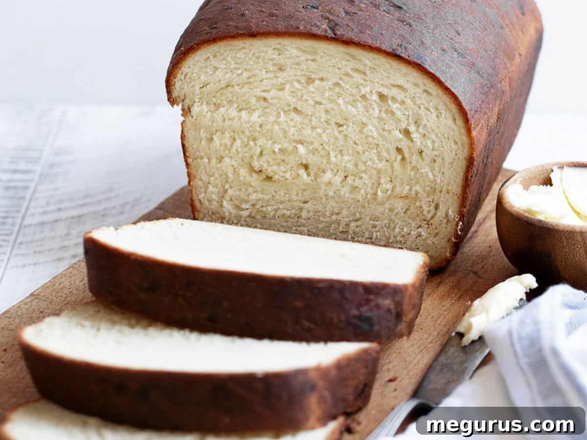 Buttermilk cheese bread sliced on cooling rack.