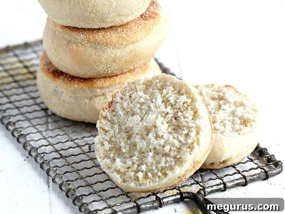 homemade english muffins stacked and split