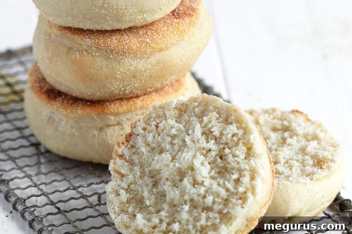 homemade English muffins stacked and split open