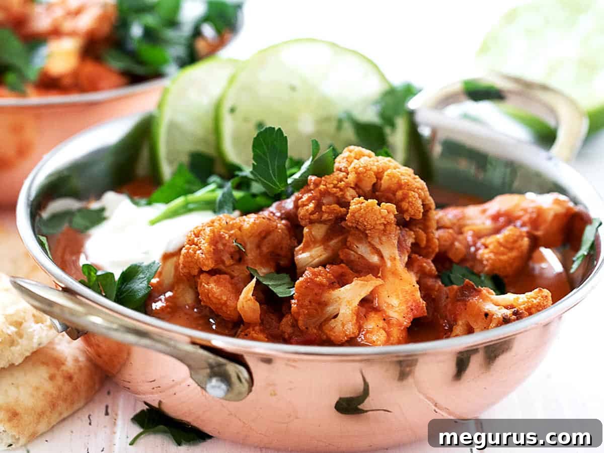 Indian cauliflower curry in copper bowls