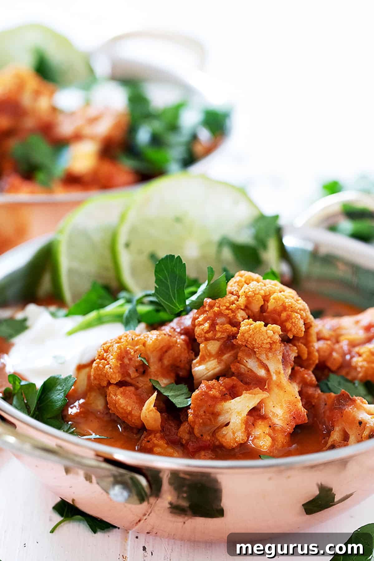 Indian cauliflower curry in copper bowls