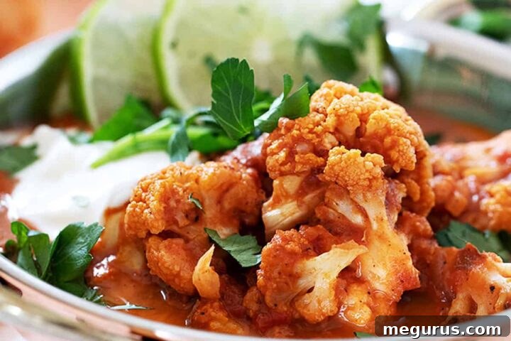 Indian cauliflower curry in copper bowls