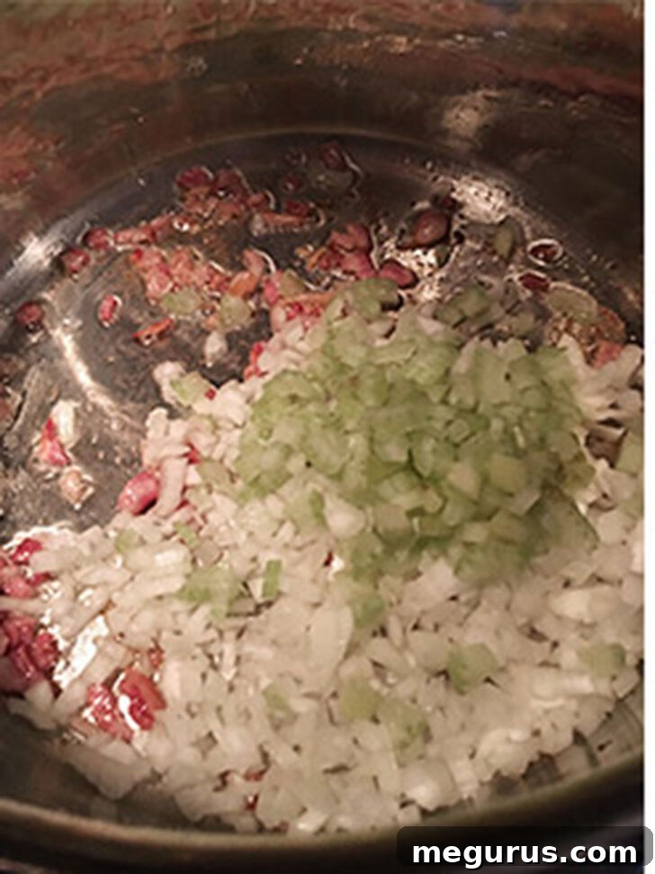 Celery and onion added to the pot.