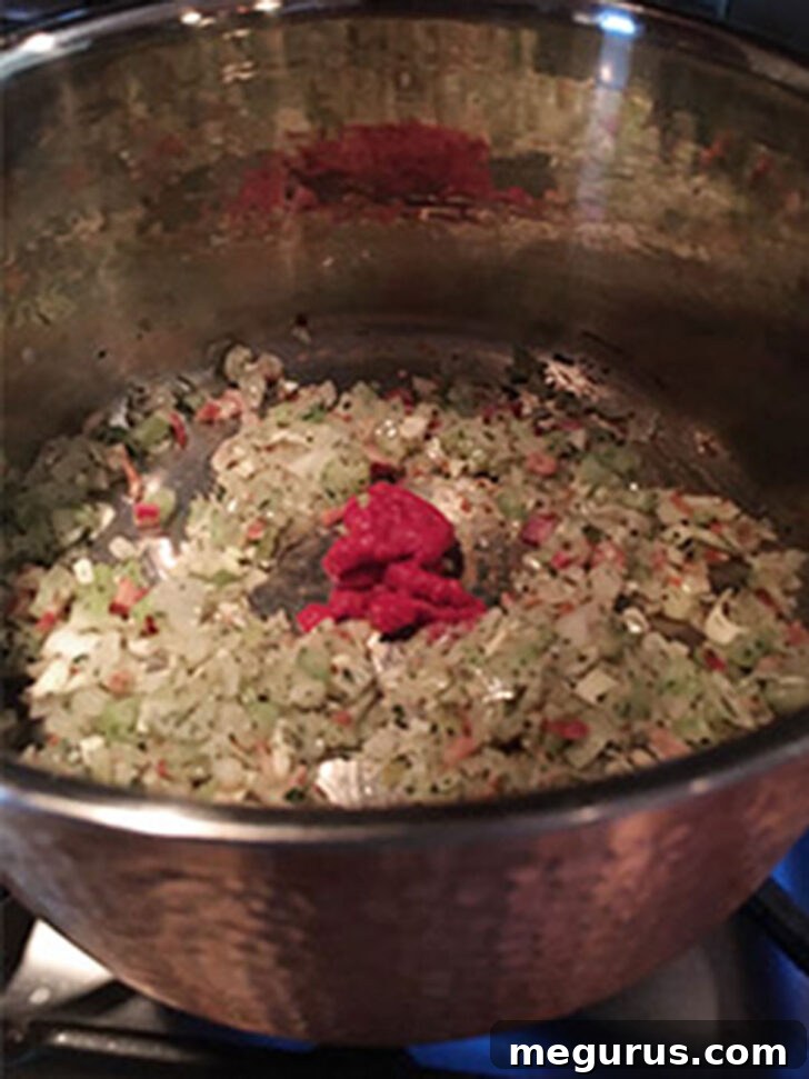 Tomato paste was added to the pot.