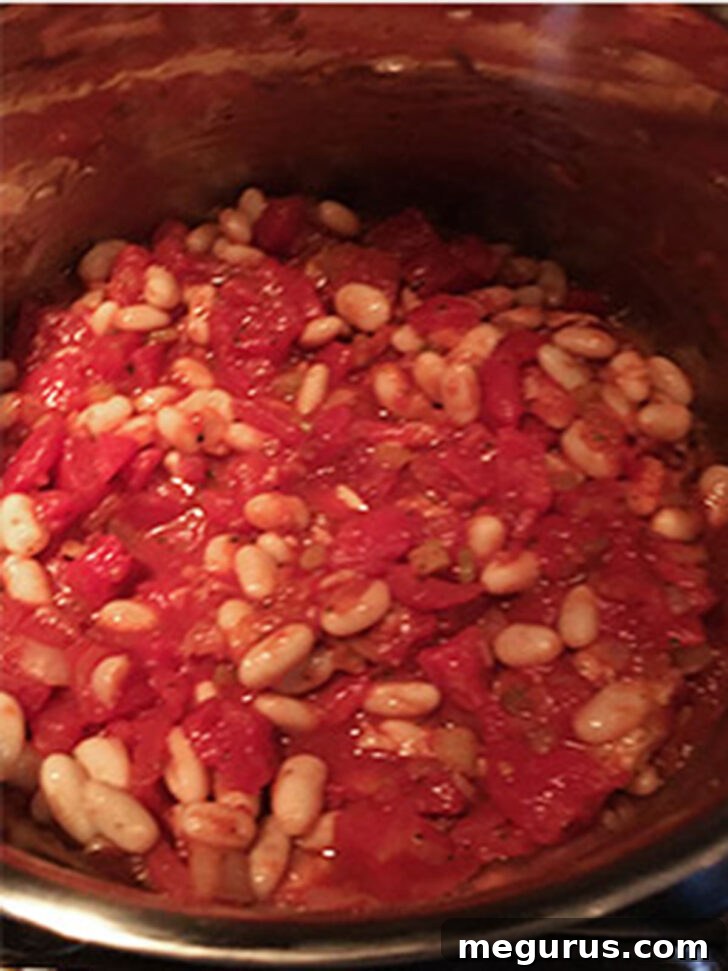Fagioli soup is cooking in the pot.