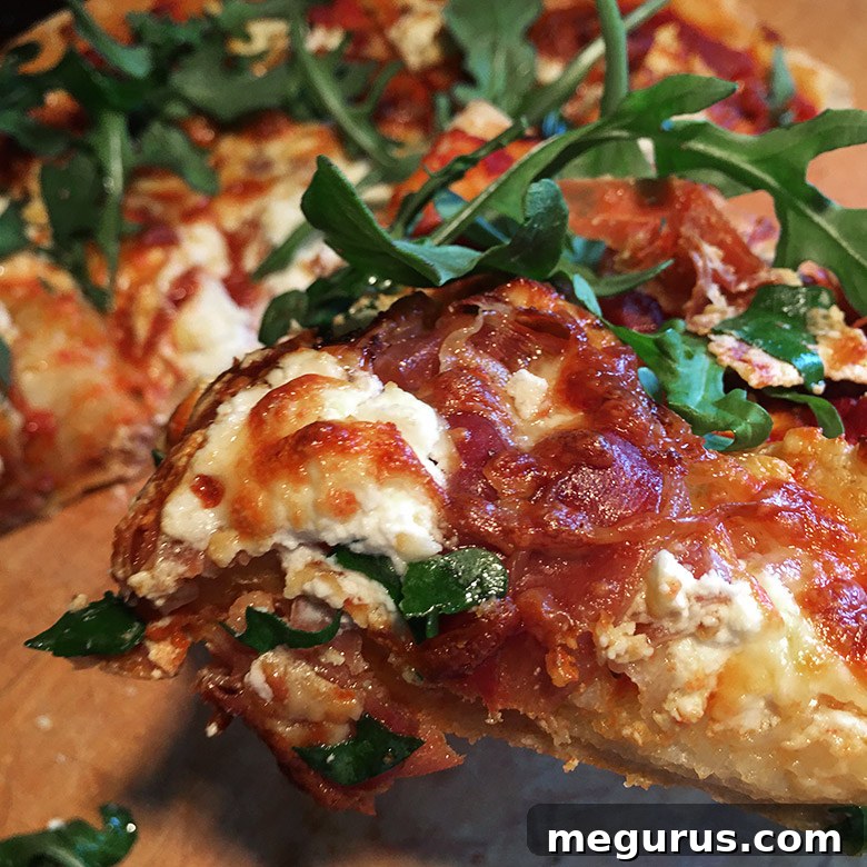 A perfectly baked slice of homemade gourmet pizza, showcasing its crispy crust and delectable toppings
