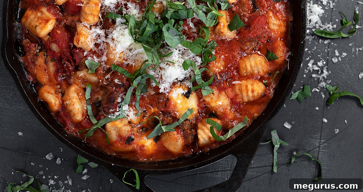 baked gnocchi with sausage in cast iron skillet