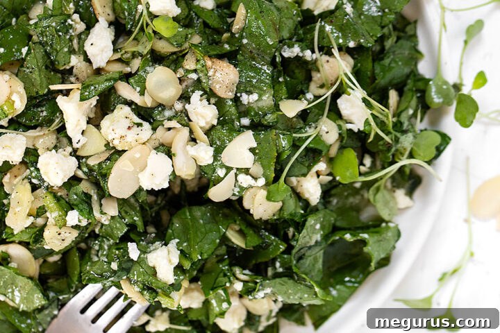 Feta Almond Salad served on a rustic plate with a fork.