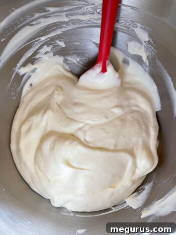 Creamy lemon filling after being thoroughly mixed, vibrant and smooth.