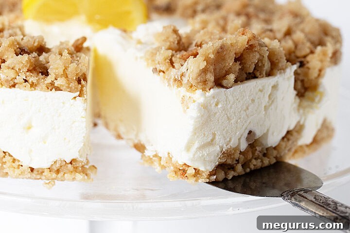 frozen lemon dessert cake on cake stand sliced