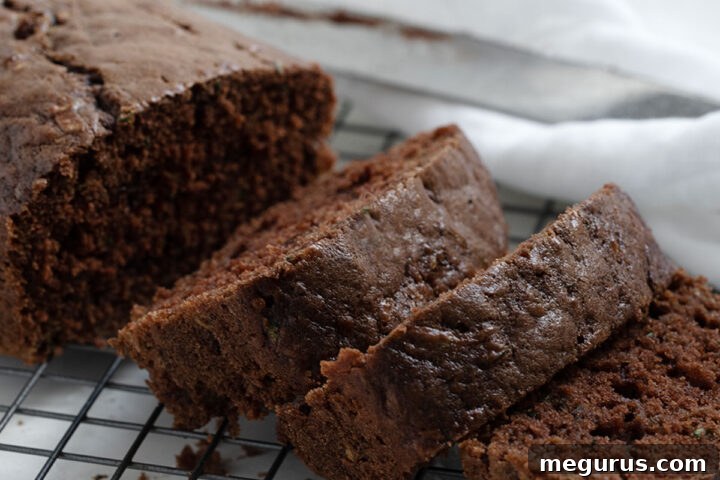 Delicious Chocolate Zucchini Bread sliced on cooling rack, ready to be enjoyed.