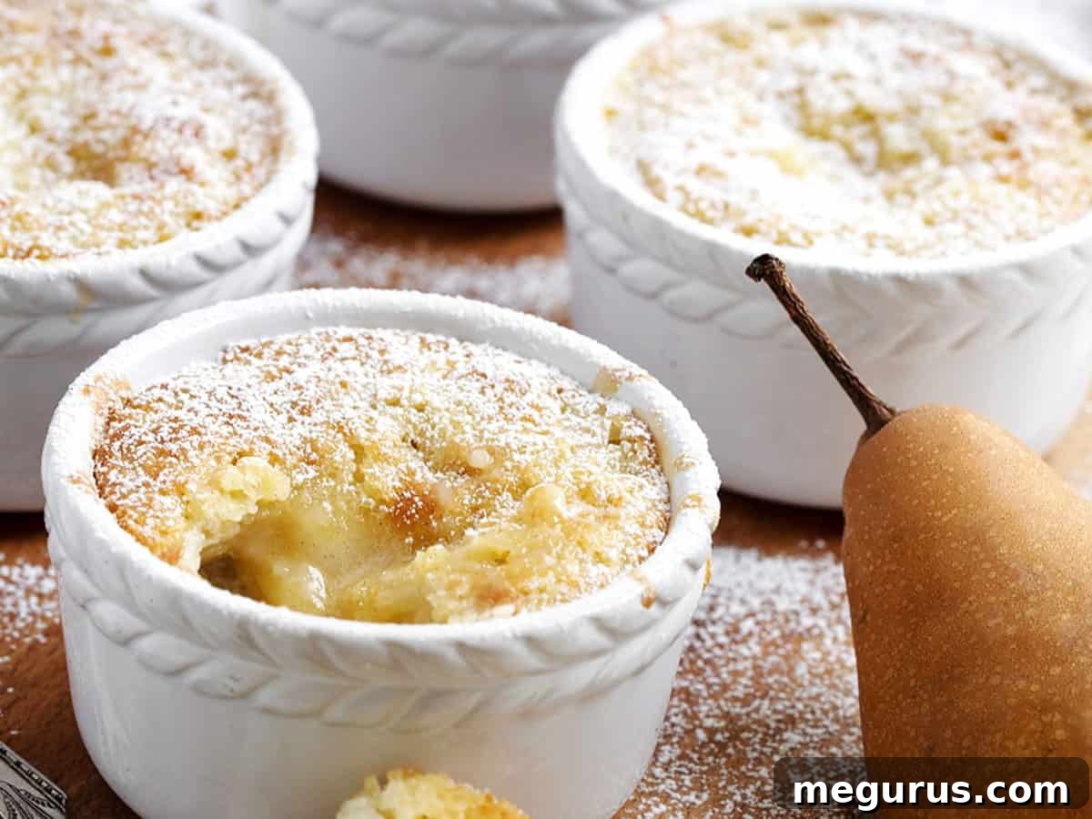 Pear Pudding Cake served in individual ramekins, highlighting its golden-brown topping and soft, custardy interior.