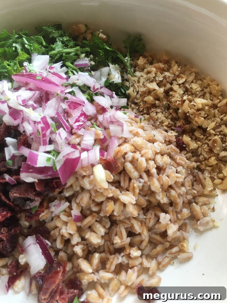 Chopped walnuts being added to the bowl, enhancing the nutty flavor and crunch.