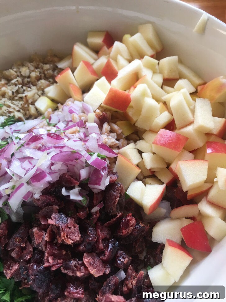 Diced fresh apple added to the salad mixture, providing crispness.