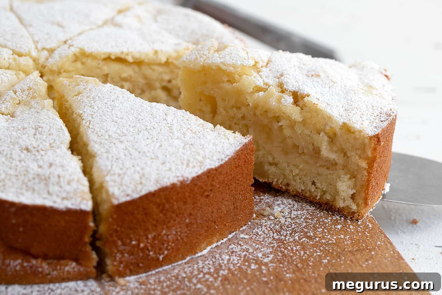Italian apple cake sliced on cutting board