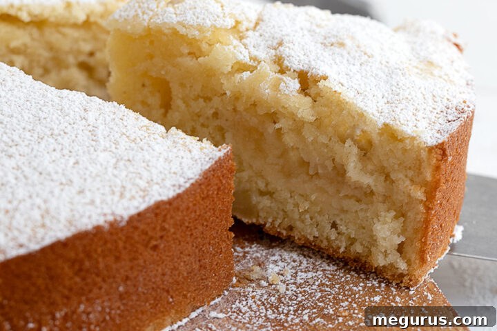Italian apple cake sliced on cutting board